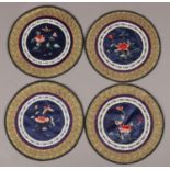Four early 20th century Chinese silk needlework roundel panels decorated with flowers, 21cm