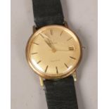 A Gentleman's Omega Geneve manual wrist watch. Gold plated, with gold satin dial, baton markers