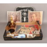 A box of memorabilia, to include Grand Ole Opry seat cushion, celebrity portraits etc.