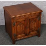 A small oak old charm side cabinet.