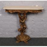 A gilt wood console table with marble effect top.