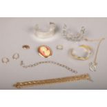 A small collection of dress jewellery including a pair of 9ct gold hoop earrings and a gilt metal