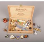 A cigar box containing assorted badges and medals including enameled and military examples Royal