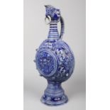 A German Westerwald very large stoneware ewer. Blue glazed and moulded with Gothic strapwork and