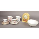 A collection of English china; Aynsley Orchard Gold mantel clock, two Spode cabinet cups and saucers