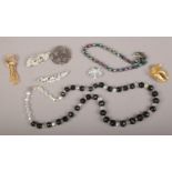 A collection of vintage costume jewellery including aurora borealis beads, Art Deco paste clip, gilt
