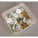 A box of watch movements and dials to include Sekonda, Waltham examples etc.