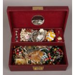 A jewellery box of costume jewellery to include bracelets, beads, brooches, rings etc.