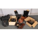 Three boxes of equestrian equipment. Including various horse tack, three saddles and two pairs of