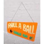A 1960's double sided perspex fairground sign, for Roll 'em' Down / Roll a Ball.