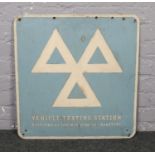 A vintage enamelled vehicle testing station sign. (64cm x 61cm).