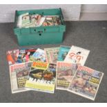 A box of paper ephemera to include 1990's / 2000's football programmes, boxing news papers,