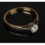 A 18ct gold and platinum diamond solitaire ring, size M, approximately 0.25ct diamond.