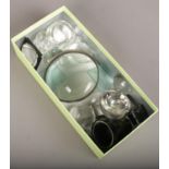 A box of glass microscope lenses.