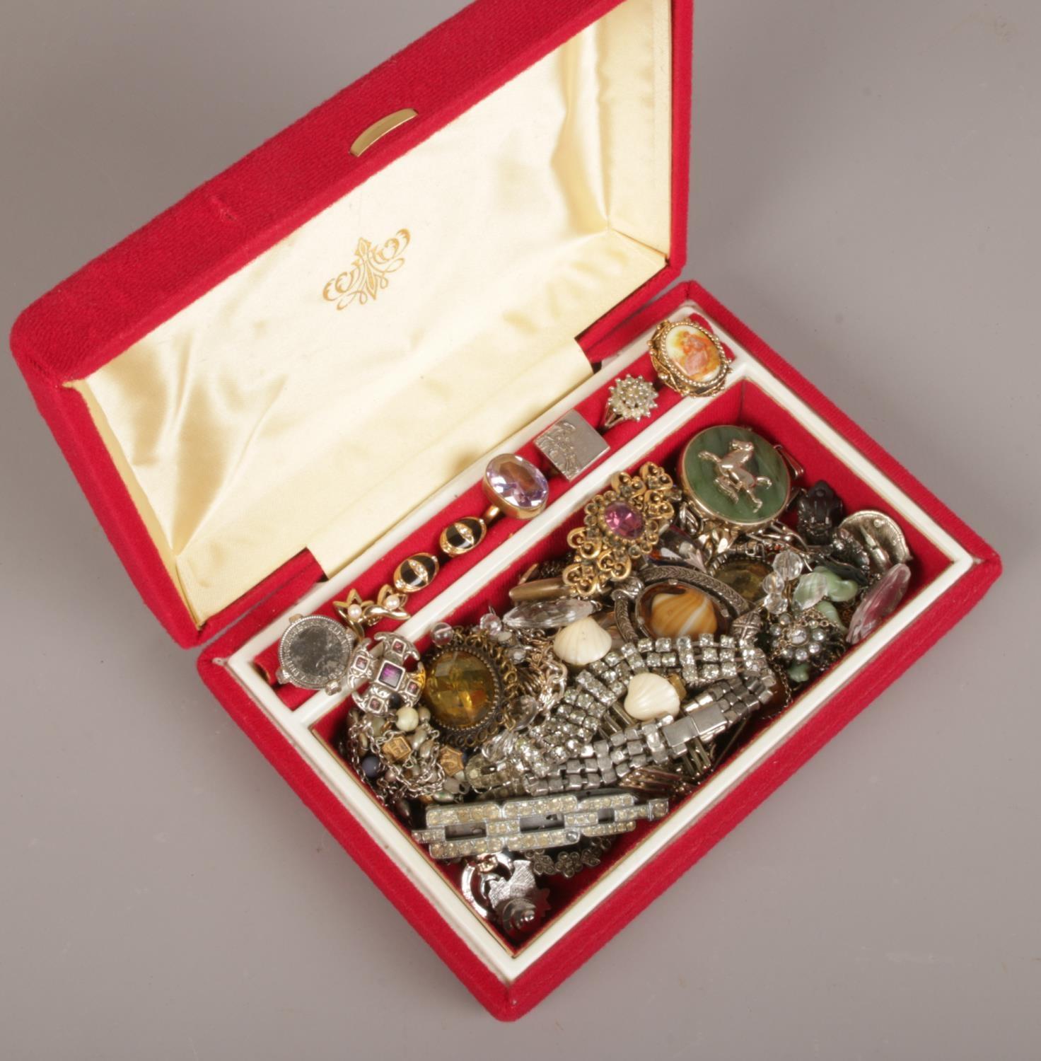 A jewellery case of costume jewellery to include rings, brooches, pendants, earrings etc.