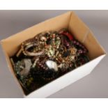 A box of costume jewellery to include beads, bangles, necklaces etc.