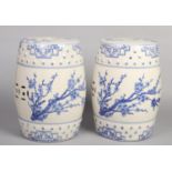 A pair of late 20th century Chinese blue and white barrel stools. Pierced, with moulded beadwork and