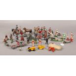 A collection of assorted vintage lead toy soldiers, horses and figures to include Lesney die cast