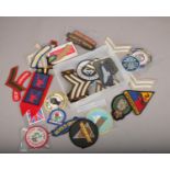 A collection of sew on badges, to include Scots Guards, Military Institute etc.