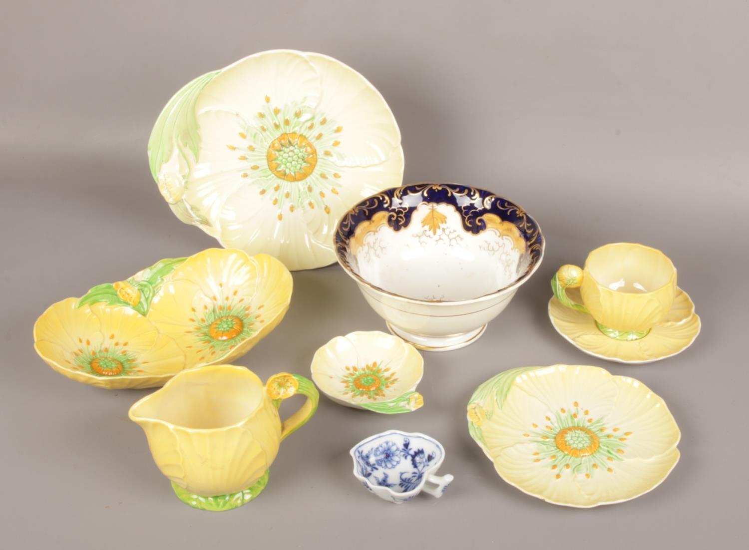 A quantity of Carltonware moulded in the yellow poppy design, an early 19th century Ridgway slop