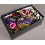 A box of costume jewellery to include beads, bangles, necklaces etc.
