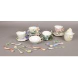 A collection of Franz porcelain, to include cups and saucers, teaspoons and a lidded pot. Good