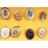 Eight vintage costume jewellery brooches.