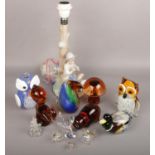 A collection of mostly art glass to include animal paperweights, Nao figural table lamp, small glass