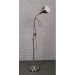 A chrome effect adjustable standard lamp.