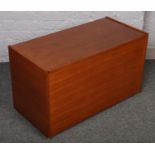 A teak blanket box.