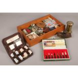 A box of collectables to include Chinese brush set, shells, desk blotter etc.