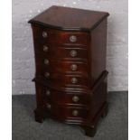 A small mahogany chest of six drawers.