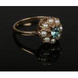 A 9ct gold blue zircon and pearl daisy cluster ring. Size Q.