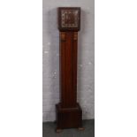 An Art Deco oak cased 8 day Westminster Grandmother clock, 44cm high. Needs repair to the works.