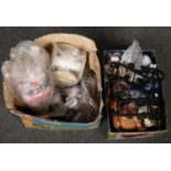 Two boxes of assorted curtain rings, pole fixings and haberdashery wares.