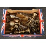 A box of brasswares, a pair of candlesticks, vases, milk pan, door knockers etc