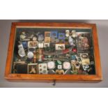 A bijoiterie cabinet of collectables to include pocket knives, coins, compacts, jewellery etc.