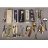 A quantity of collectors spoons, ivory handled sewing necessaire and silver plated sugar tongues