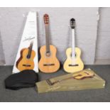 Two boxed classical Jose Ferrer acoustic guitars, one full size.