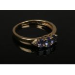 A 9ct gold tanzanite and diamond dress ring. Size L.