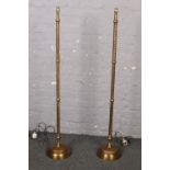 A pair of Laura Ashley brushed brass standard lamps