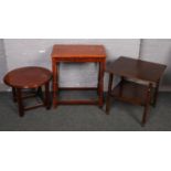 A mahogany occasional table along with a mahogany to tier table and another side table.