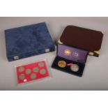 A cased gold and silver jubilee limited edition coin set, along with a Queen Elizabeth half crowns