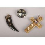 A gilt metal and enamel cross along with a pique brooch and pendant.