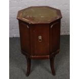 A small leather inset top drinks cabinet.