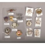 A collection of cap badges, to include Salvation Army, Royal Marines, Irish Guards etc.