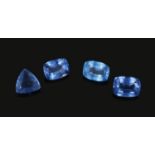 Four large heat treated natural sapphires. Each cased, trillion and cushion cut, 5.6ct - 7.95ct.