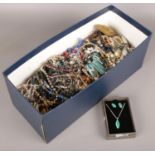 A box of costume jewellery to include beads, bangles, necklaces, brooches etc.