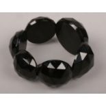 A faceted jet bracelet.