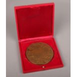A Monnial de Paris Bronze Zodiac medallion in case